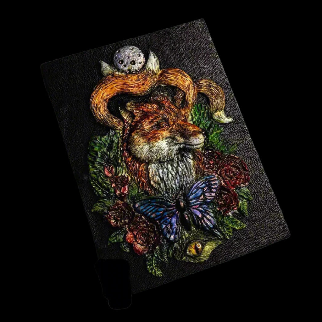 Embroidered patch with a fox, owl, and butterfly on a dark background