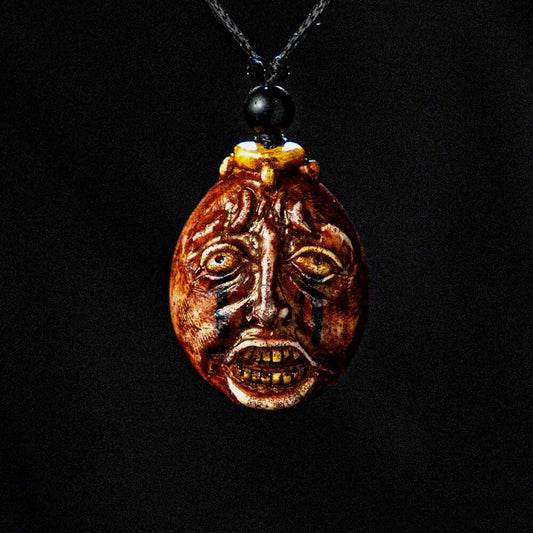 Behelit egg pendant necklace